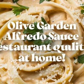 Homemade Olive Garden Alfredo Sauce copycat served alongside crispy garlic breadsticks