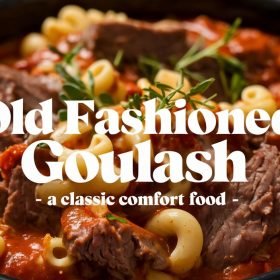 Warm and comforting old fashioned goulash plated with a side of steamed green beans and mashed potatoes.