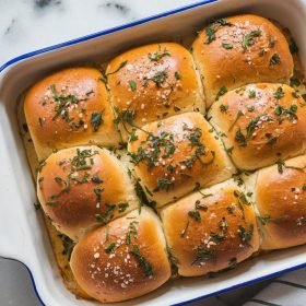 Stack of Buffalo Chicken Sliders garnished with fresh lettuce, courtesy of Blackstone Recipes
