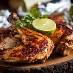Delicious Tandoori Chicken Recipe with marinated, tender chicken grilled to smoky perfection and garnished with fresh cilantro.
